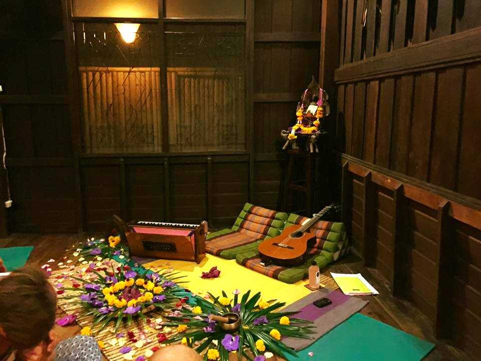 musical instruments and flowers laid out for kirtan mantra and acoustic music event at Wild Rose Yoga Chiang Mai Thailand